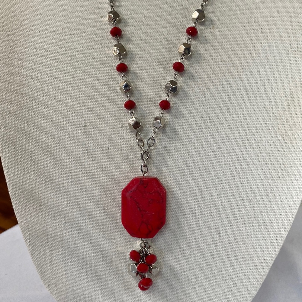 Long silvertone necklace with large faux red marble dangle